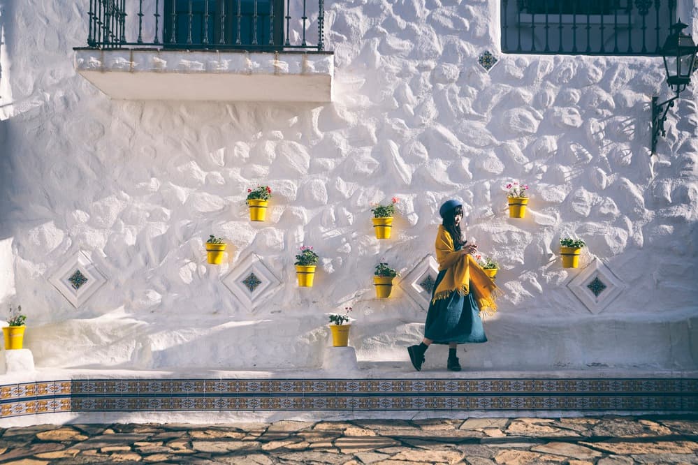 Woman Yellow Pots Village by 7 Flavor C/P — canvas wall art