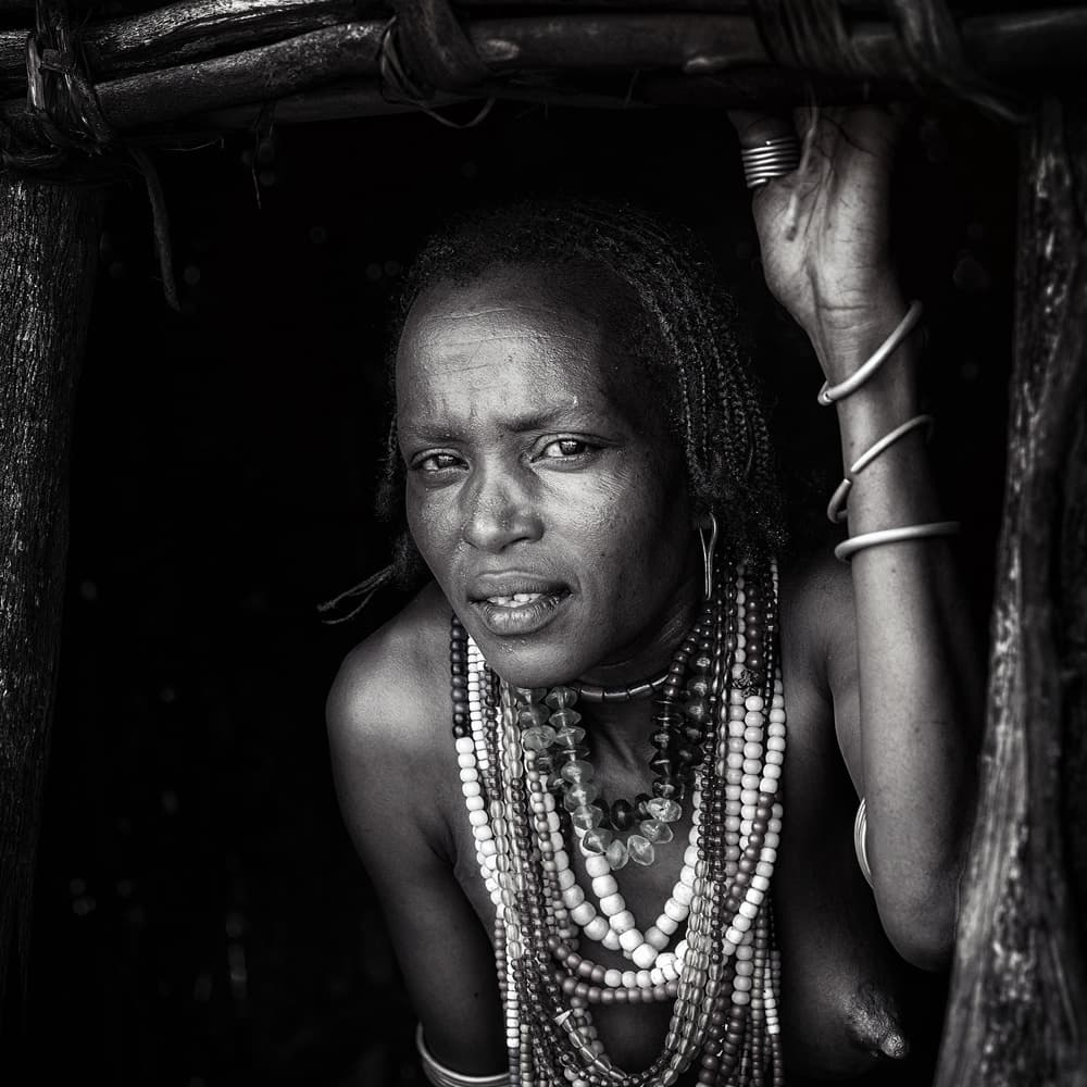 African Woman Deep Gaze by Piet Flour — canvas wall art