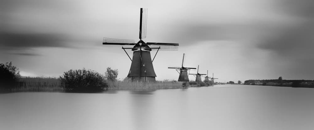 Windmills Over Water by Saskia Dingemans — canvas wall art