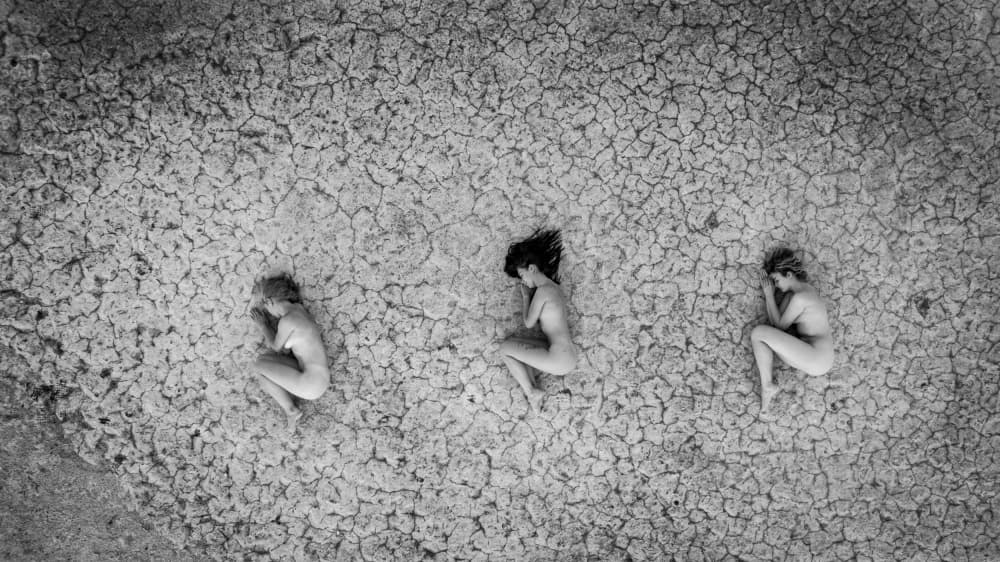Women On Cracked Earth by Raul Ghiman — canvas wall art