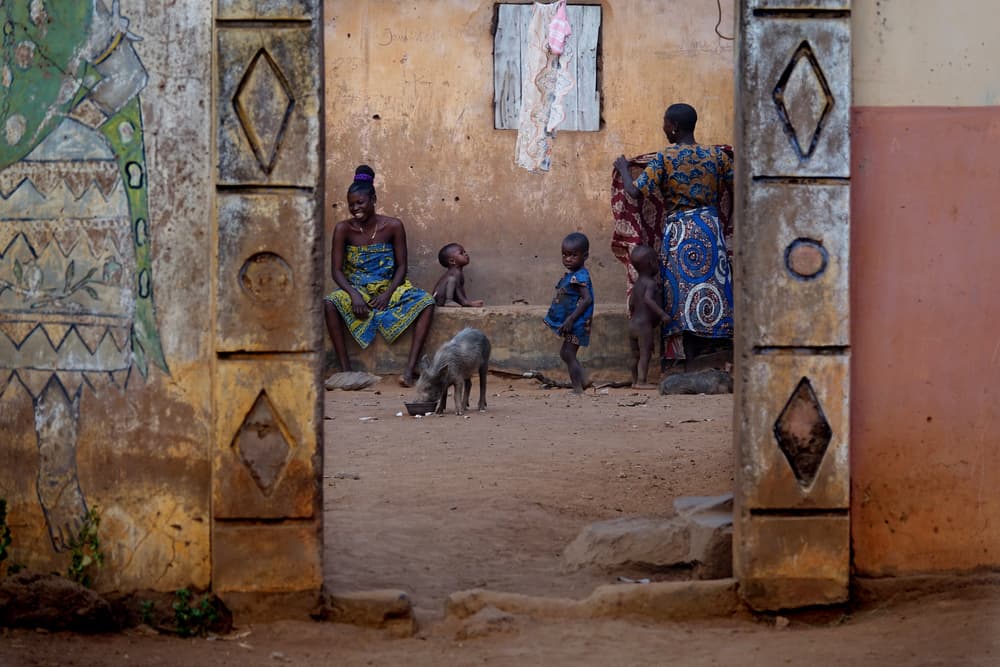 Smiling Village Family by Elena Molina — canvas wall art