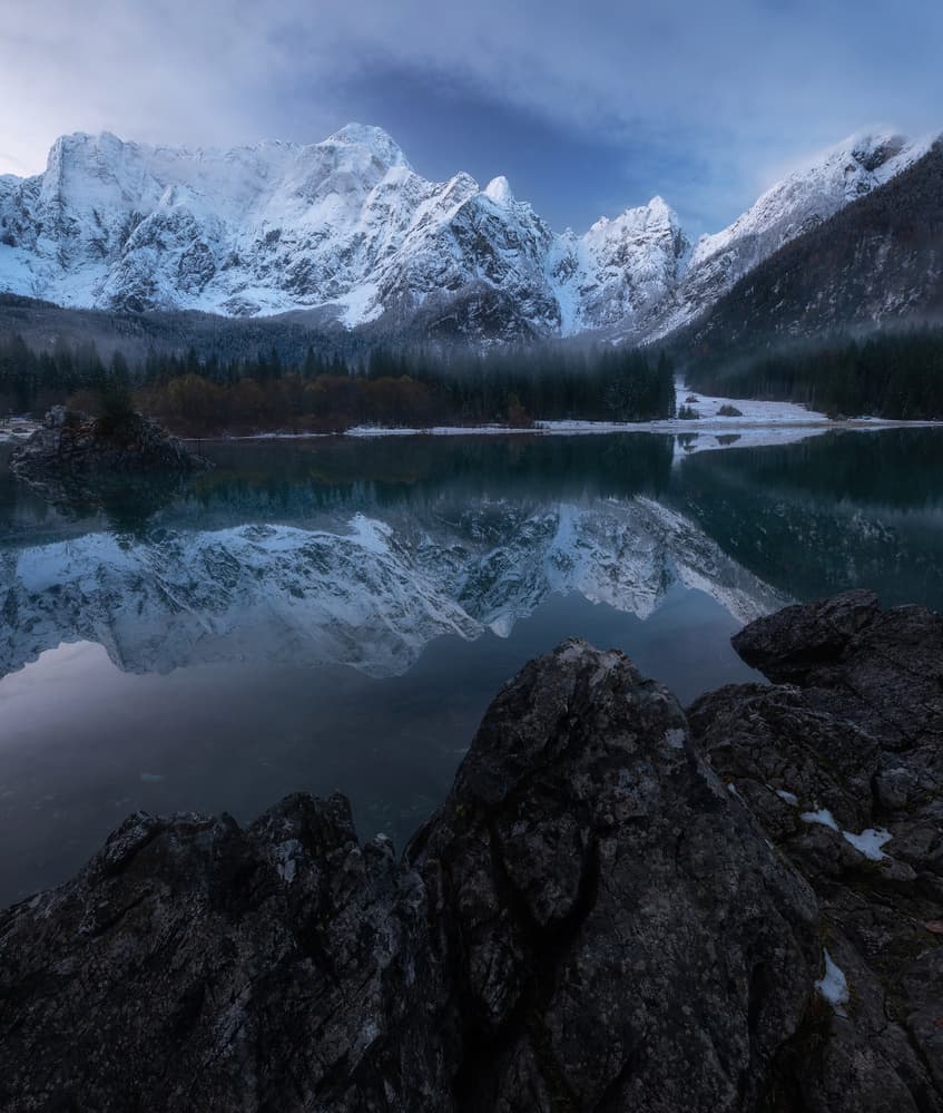 Snowy Mountain Lake Reflection by Ales Krivec — canvas wall art