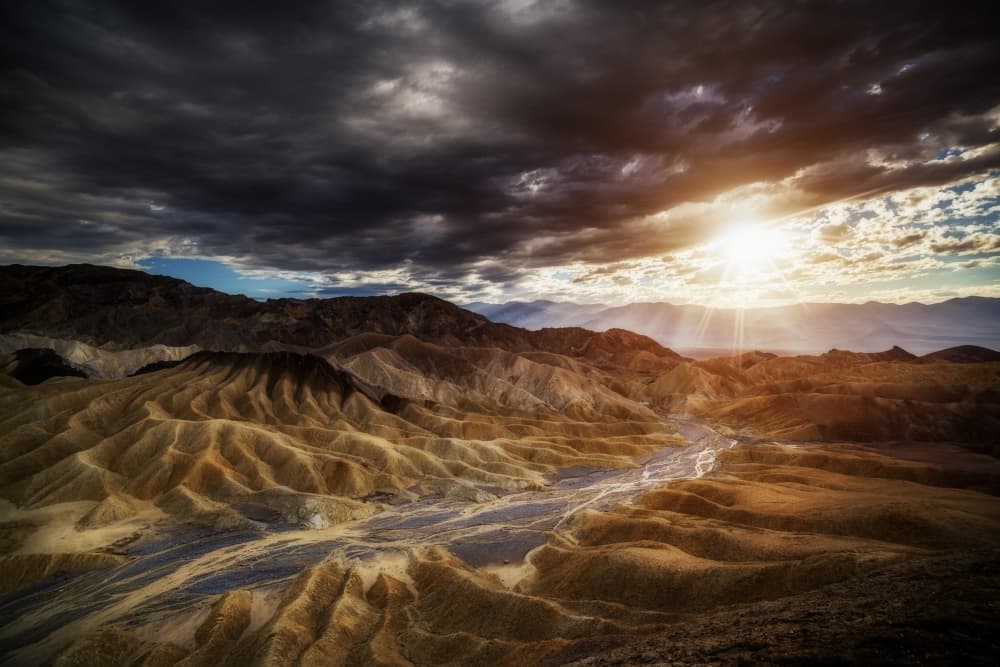 Desert Sunburst Over Badlands by Juan Pablo de Miguel — canvas wall art