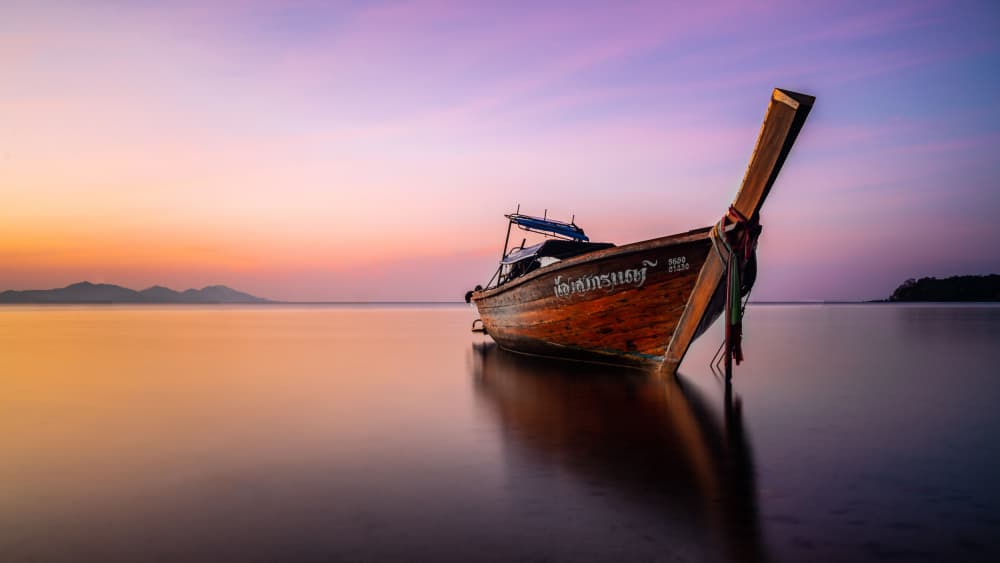 Tranquil Longtail Sunset by Saulius — canvas wall art