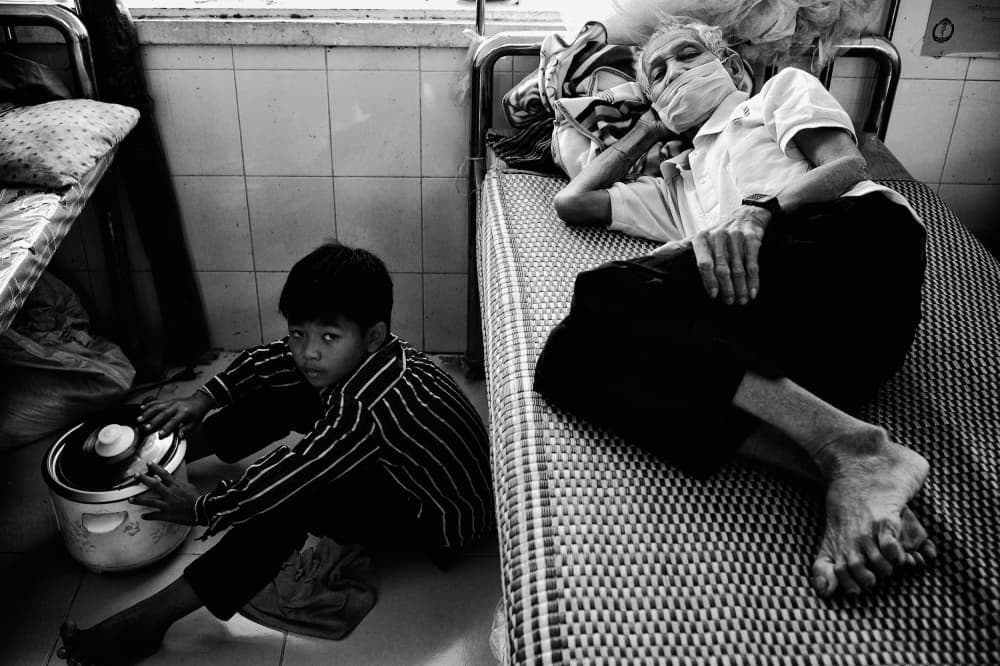 Young Boy Beside Patient by Shinji Isobe — canvas wall art