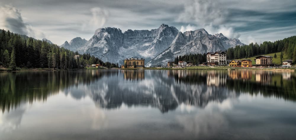 Alpine Lake Village Reflections by Tommaso Pessotto — canvas wall art