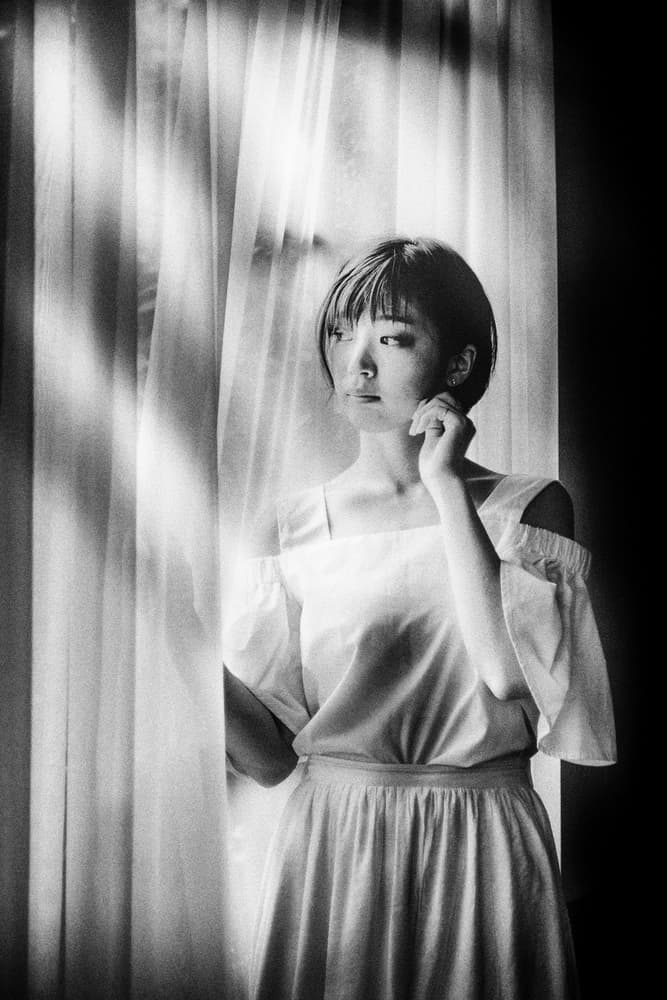 Pensive Woman by Window by Masatoshi Washimi — canvas wall art