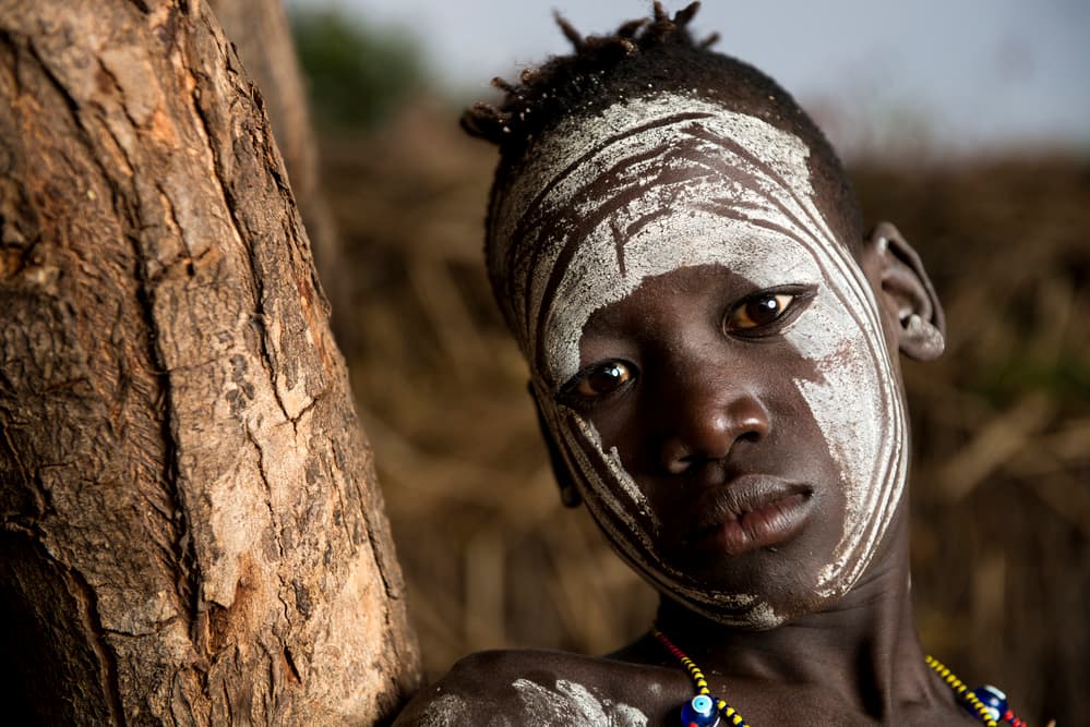African Painted Face by Mohammed Al Sulaili — canvas wall art