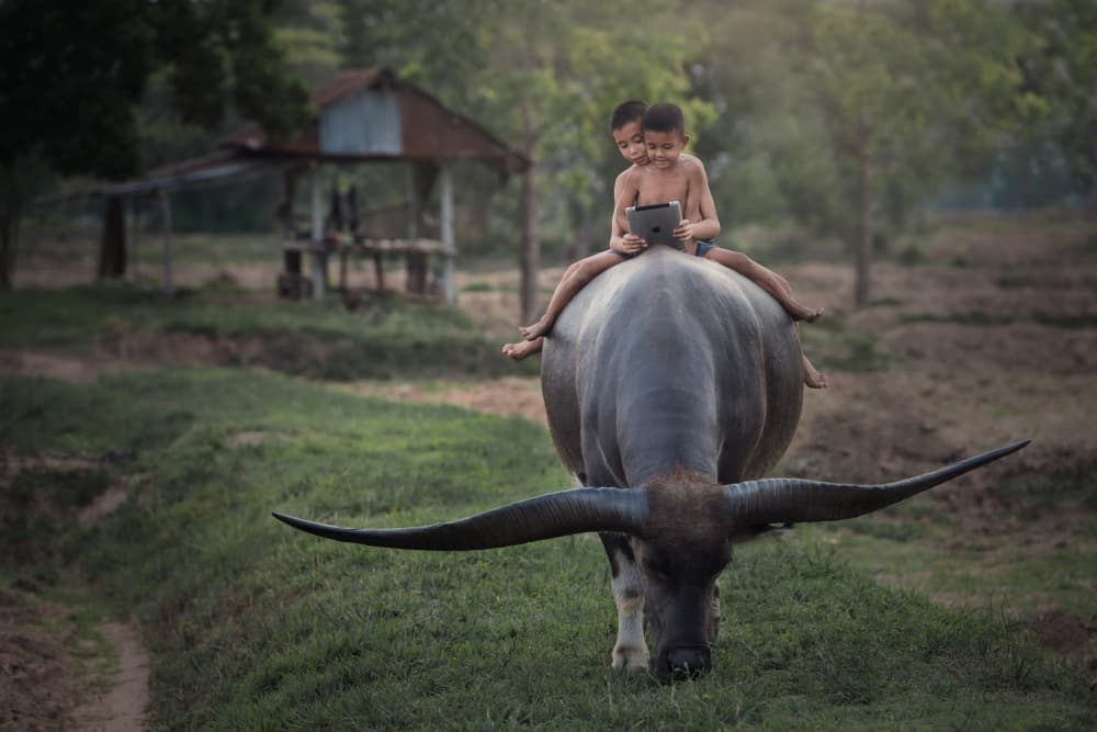 Rural Kids Tech Ride by Sarawut Intarob — canvas wall art