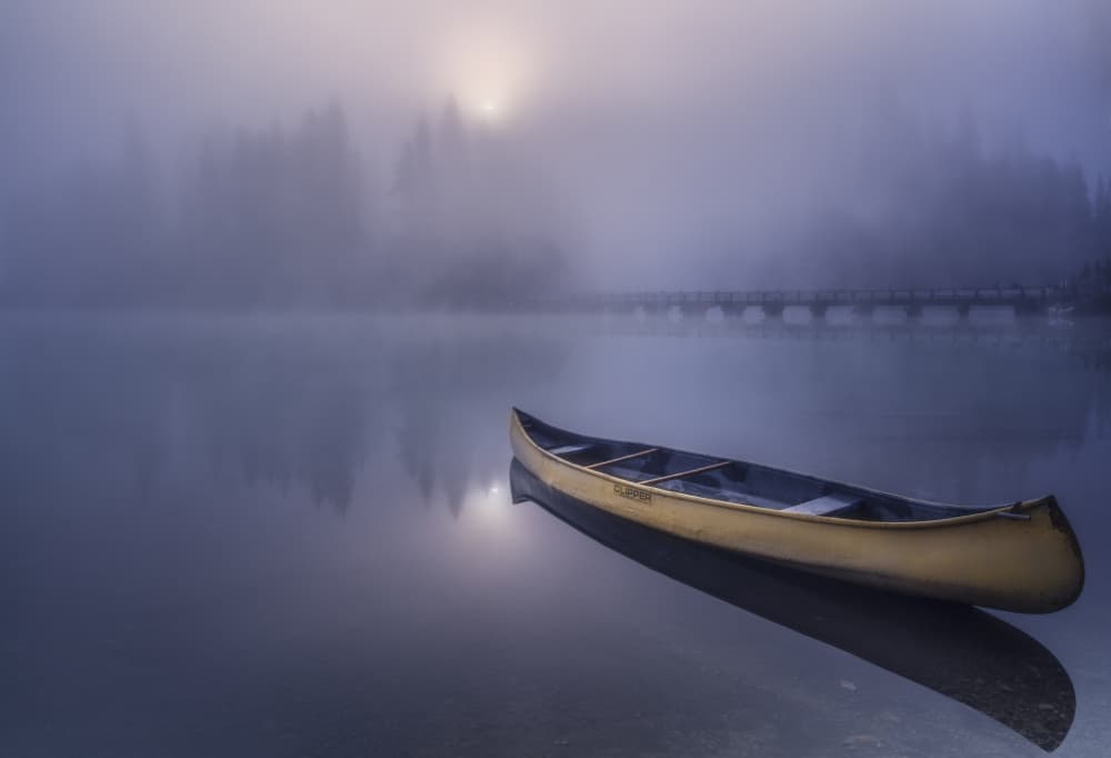 Misty Lake Canoe by Evgeny Chertov — canvas wall art