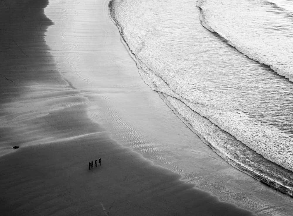 Monochrome Beach Walkers by Adolfo Urrutia — canvas wall art