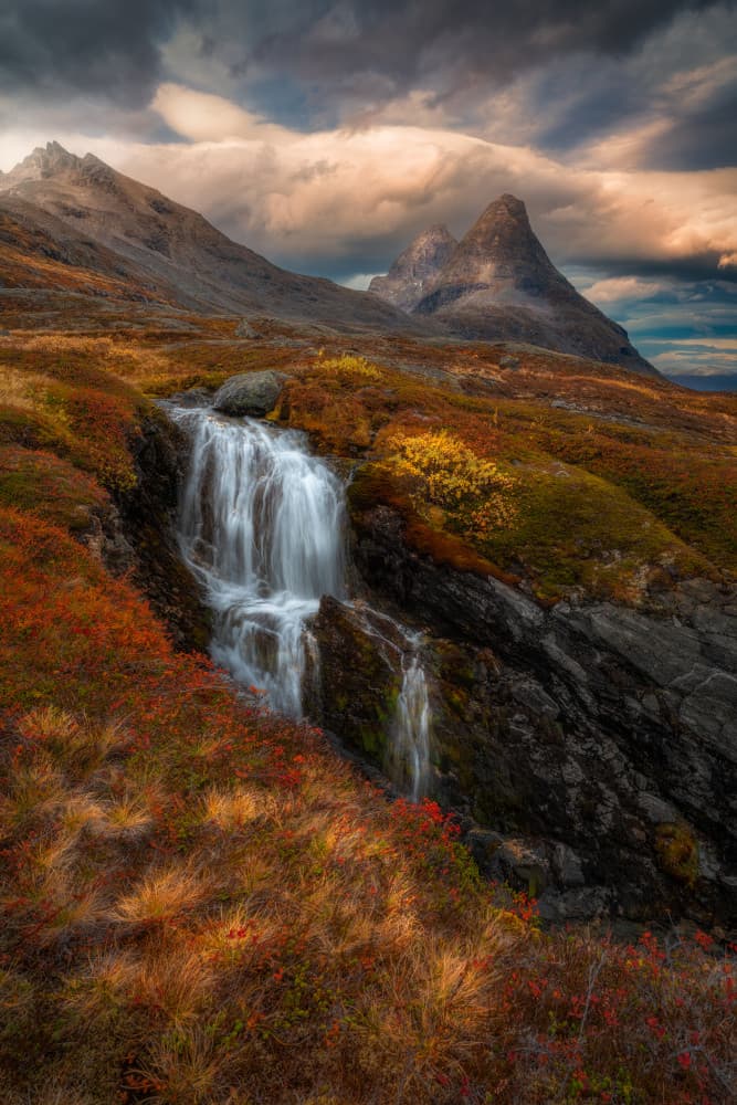 Vibrant Autumn Waterfall by Ole Henrik Skjelstad — canvas wall art