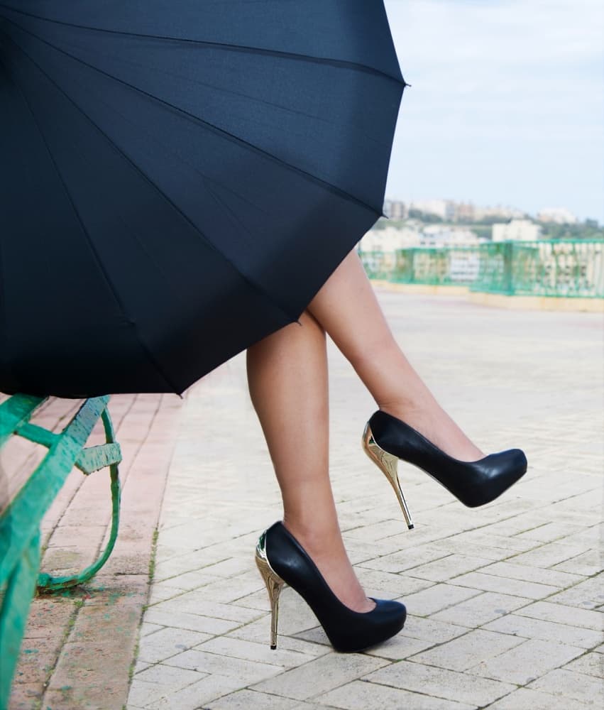 Stylish Heels Under Umbrella by Renata Apanaviciene — canvas wall art