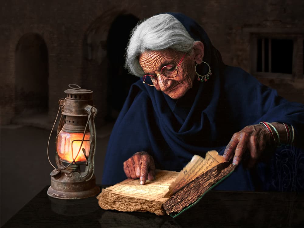 Elder Reading by Lantern Light by Sayyed Nayyer Reza — canvas wall art