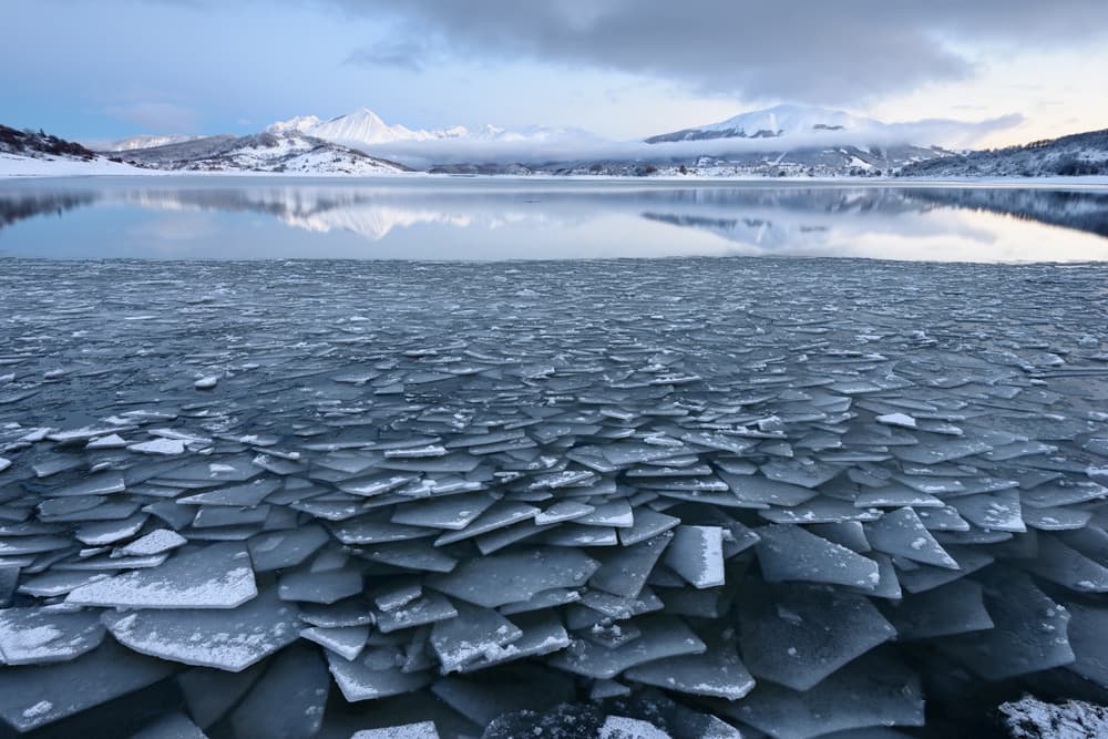 Icy Mountain Lake Reflection by Riccardo Lucidi — canvas wall art