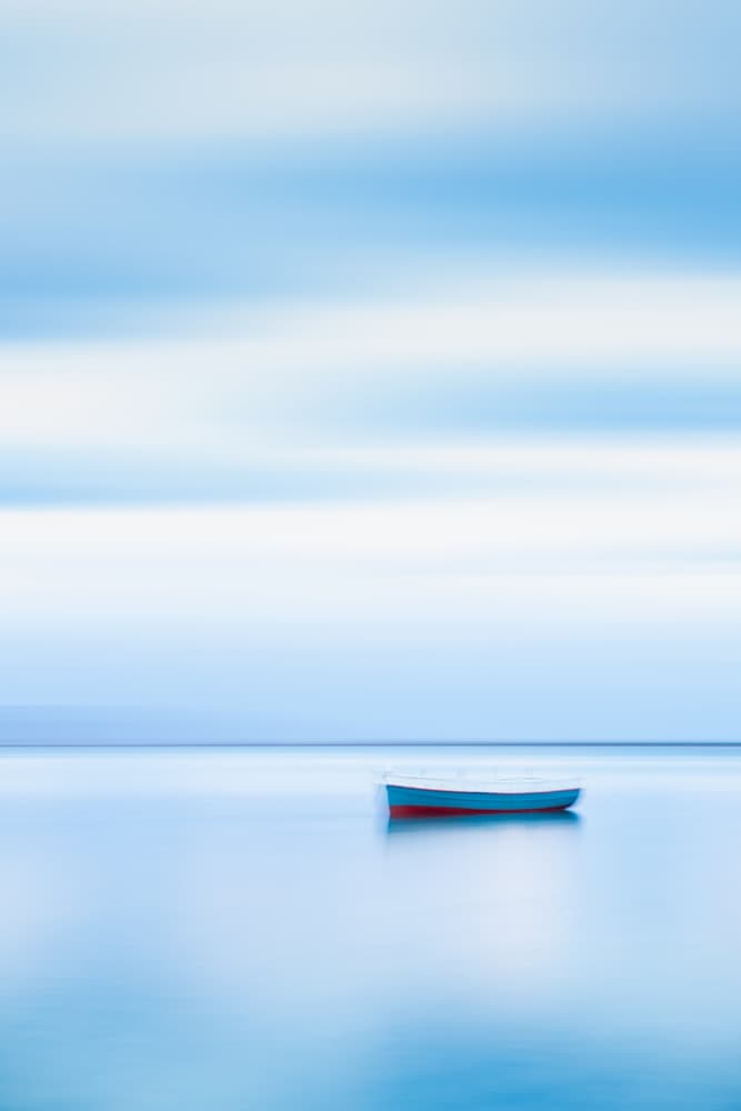 Serene Blue Boat by Dorian Gray — canvas wall art
