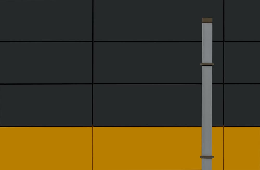 Geometric Grey Yellow Facade by Jan Niezen — canvas wall art