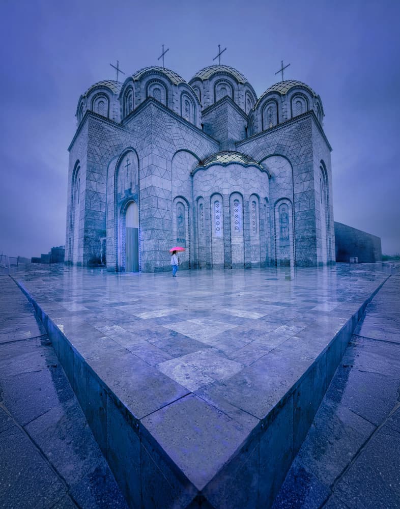 Red Umbrella at the Cathedral by Yuan Su — canvas wall art