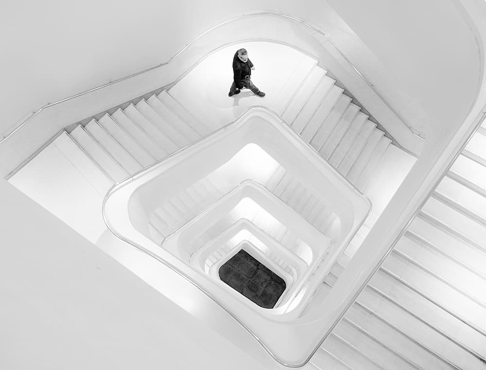 Man Descending Spiral Stairs by Adolfo Urrutia — canvas wall art
