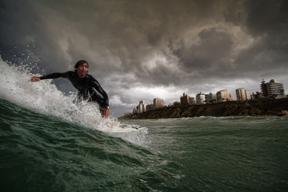 Stormy City Surfer by Assaf Gavra — canvas wall art