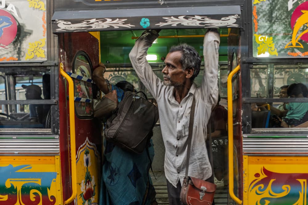 Man on a Colorful Bus by Corinne Spector — canvas wall art