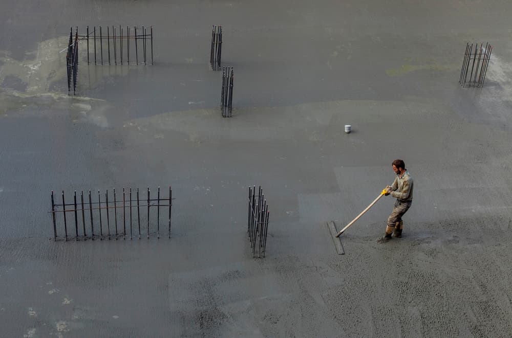 Construction Worker Leveling Concrete by Ramiz Sahin — canvas wall art