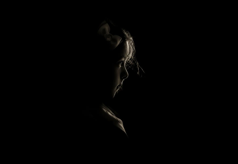Pensive Girl in Shadow by Larry Deng APA — canvas wall art