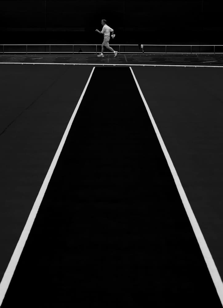 Solitary Runner on Track by Fengshou . Lin 林峰守 — canvas wall art