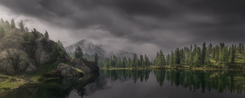 Moody Mountain Lake by Paco Jimenez — canvas wall art