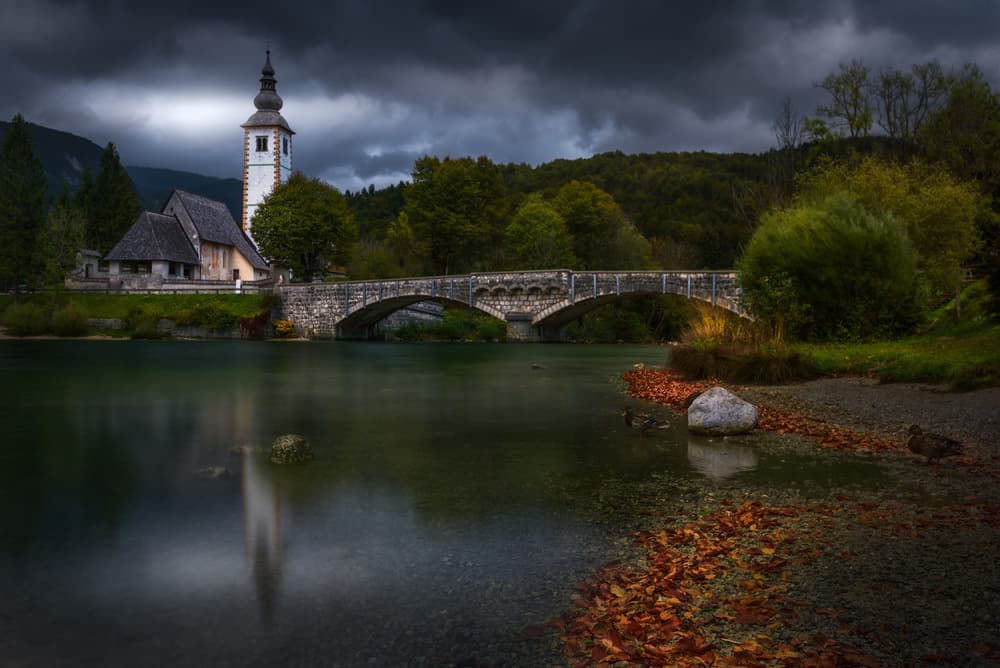 Dramatic Autumn River Church by SANDEEP MATHUR — canvas wall art