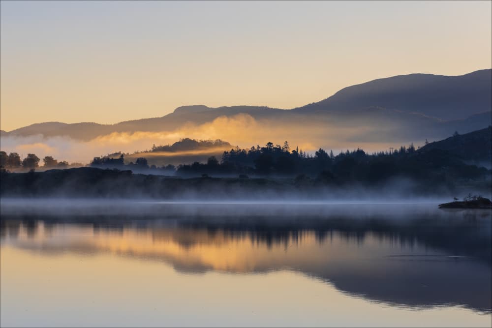 Misty Lake Sunrise Glow by Aleksandra Brodecka — canvas wall art