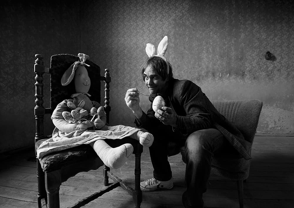 Bunny Man Decorates Egg by mario grobenski - psychodaddy — canvas wall art