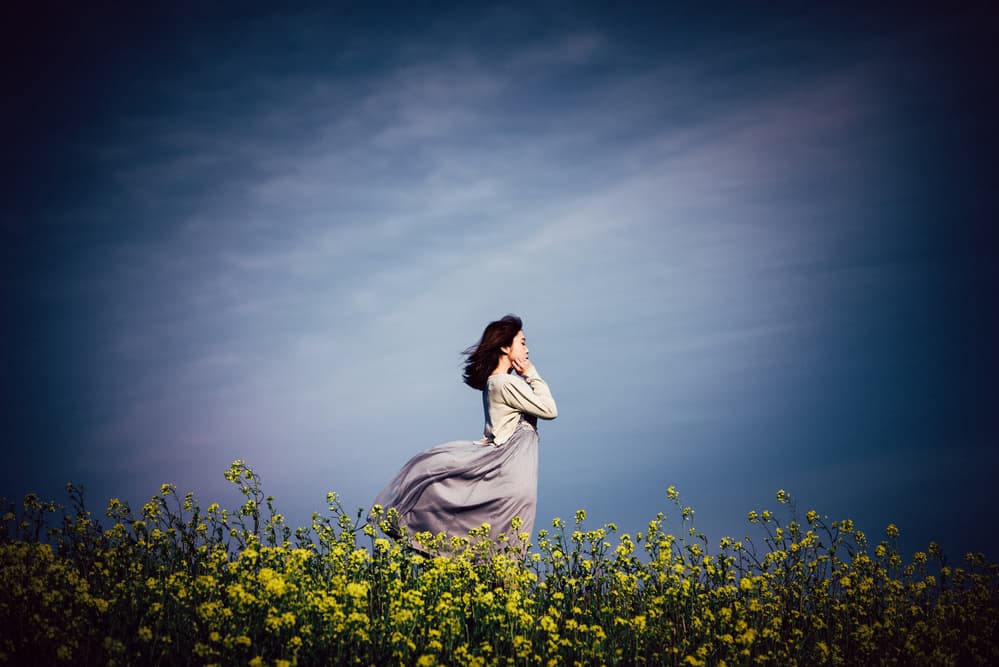 Windblown Woman Yellow Field by Yuki Yatsushima — canvas wall art