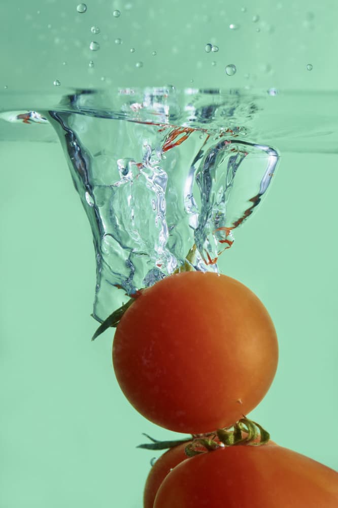 Red Tomatoes Splash by Angelo Giampiccolo — canvas wall art