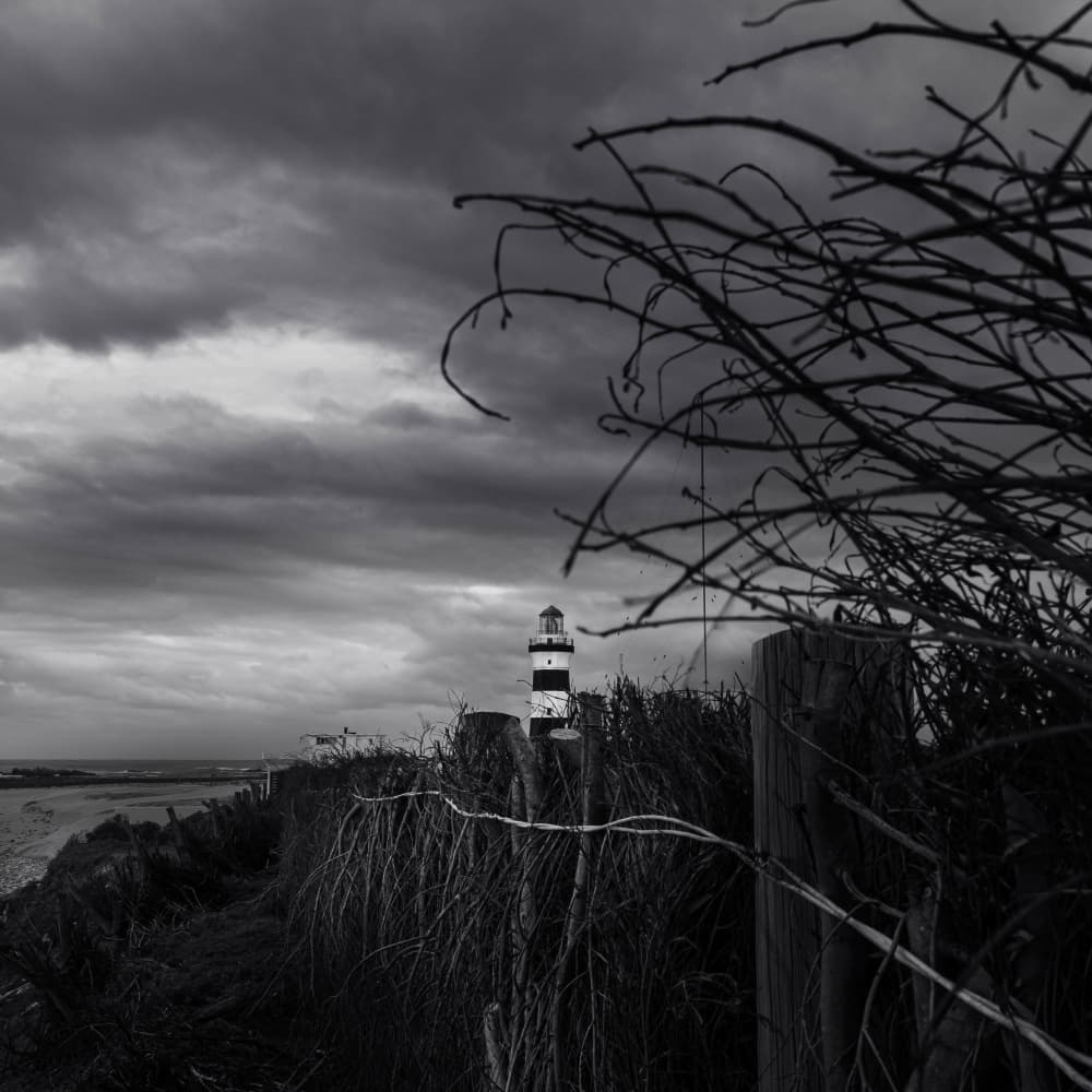 Moody Coastal Lighthouse by Ray Truter — canvas wall art