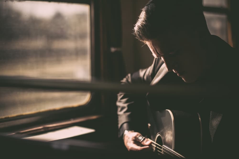 Moody Guitar Player by David Jasper Blum — canvas wall art