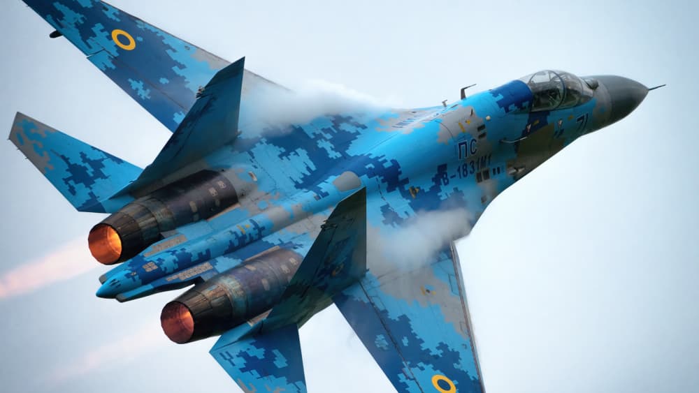 Dynamic Blue Camo Fighter Jet by Piotr Wrobel — canvas wall art
