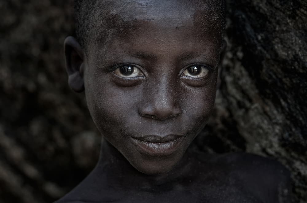Soulful African Boy Portrait by Joxe Inazio Kuesta Garmendia — canvas wall art