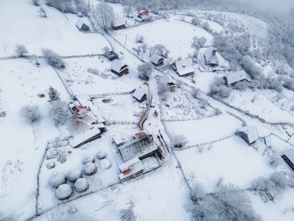 Snowy Mountain Village by Ovidiu Satmari — canvas wall art
