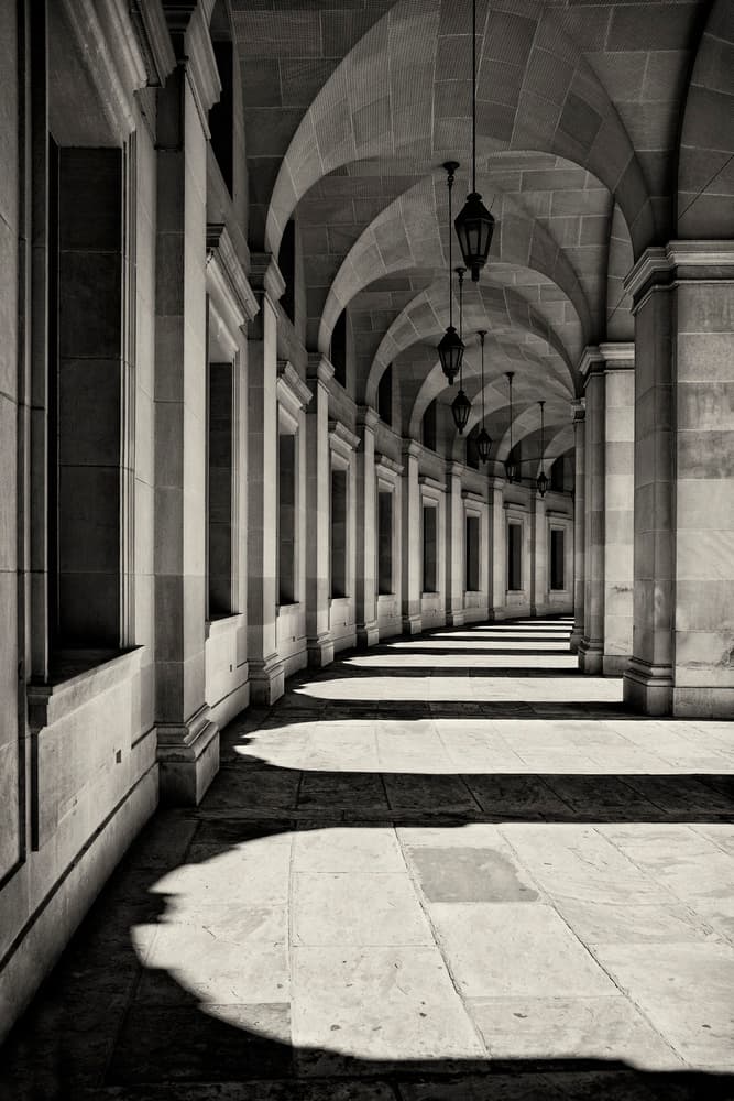 Arched Hallway Shadows by Louise Wolbers — canvas wall art