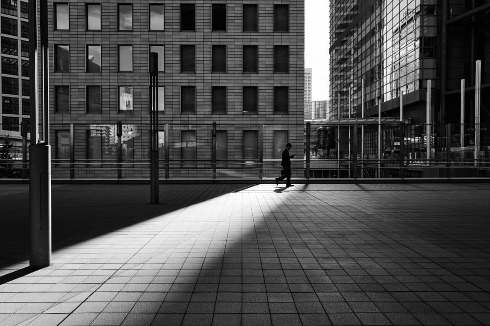 Man Walks Urban Shadows by Kaku Tanaka — canvas wall art