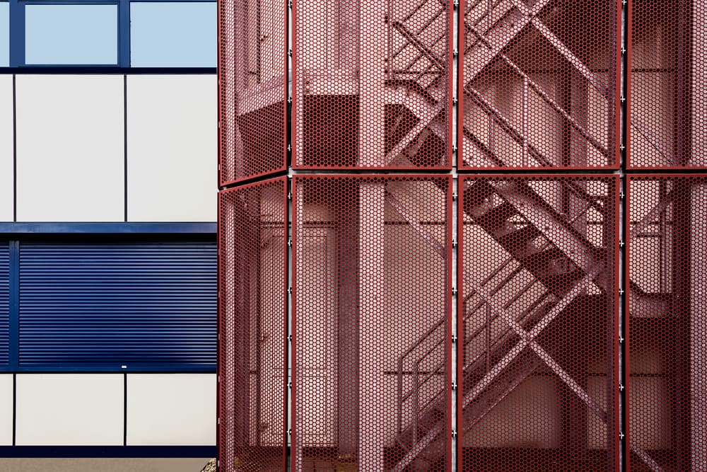 Red Mesh Blue Building by Henk van Maastricht — canvas wall art