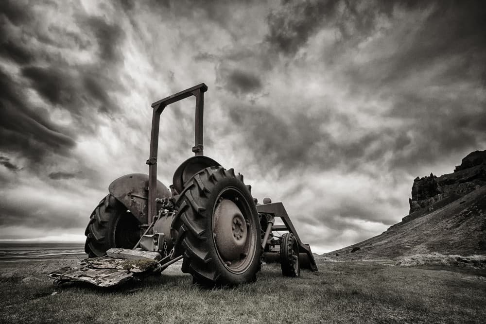 Old Tractor Stormy Sky by Þorsteinn H. Ingibergsson — canvas wall art