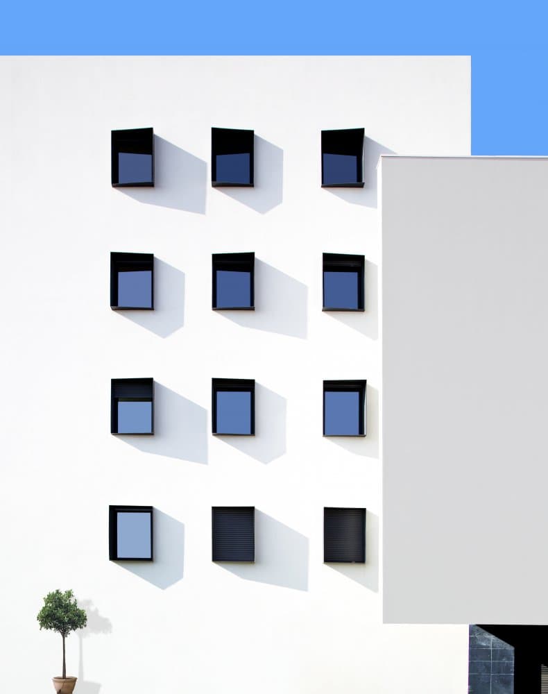 White Building Blue Windows by Fernando Piçarra — canvas wall art
