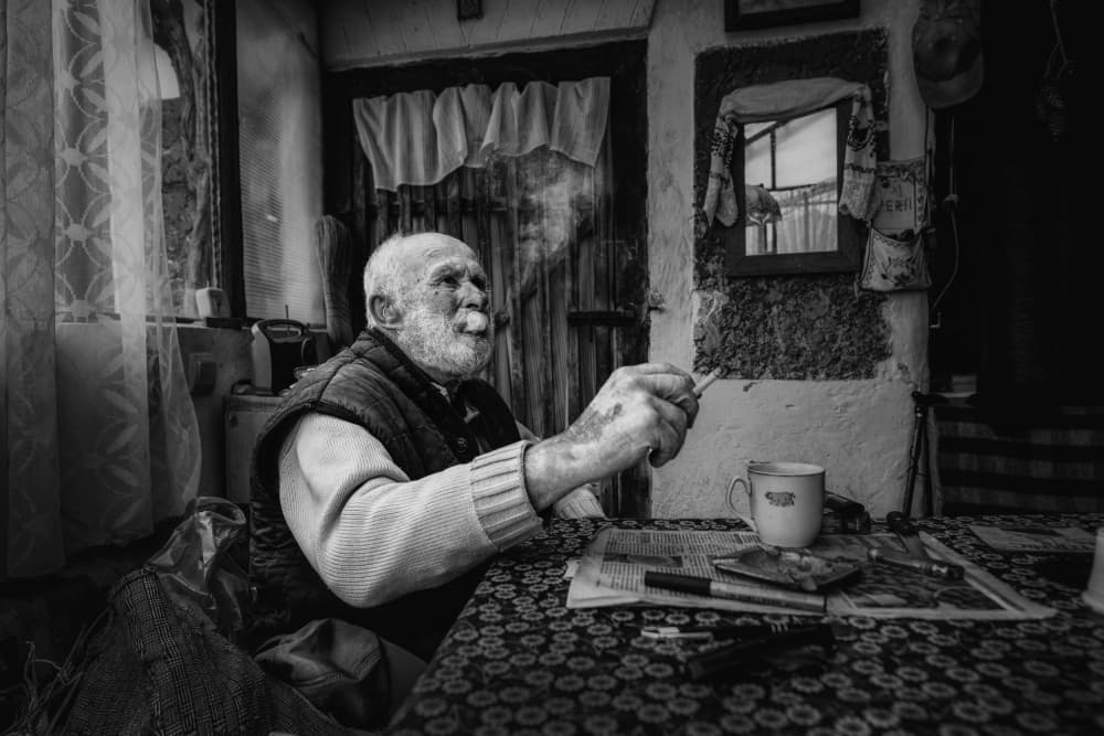 Contemplative Old Man Smoking by Grigore Roibu — canvas wall art