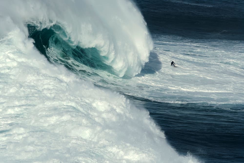 Surfer Rides Massive Wave by Rui Correia — canvas wall art
