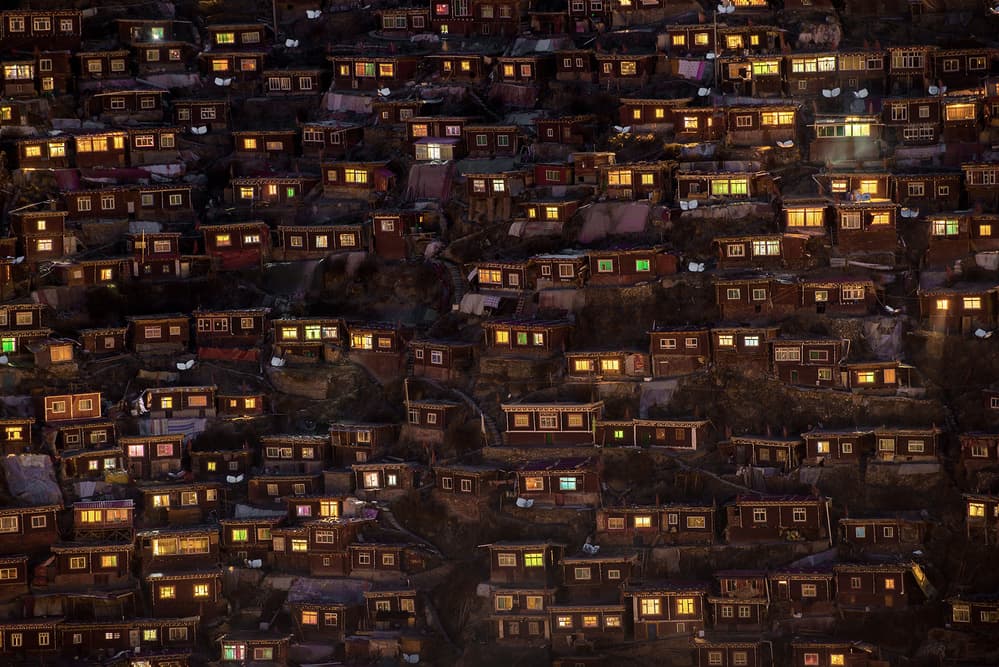 Glowing Hillside Homes by Sarawut Intarob — canvas wall art