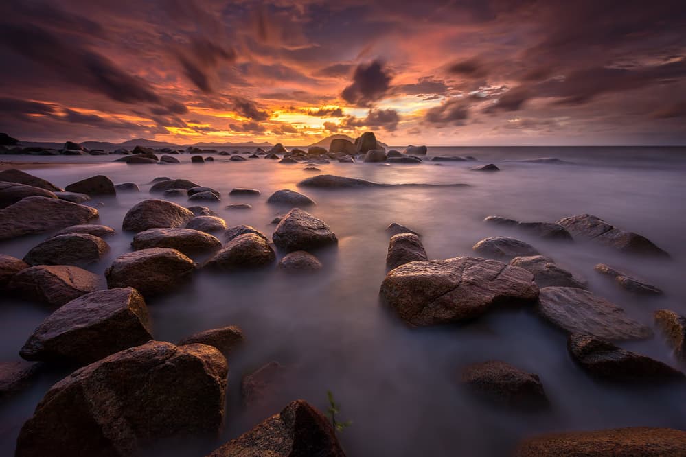 Misty Coastal Rocks Sunset by Gunarto Song — canvas wall art