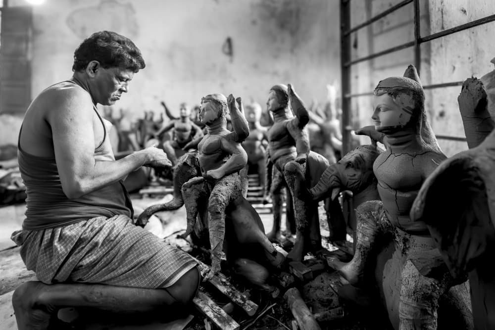 Artisan Shaping Clay Idols by BALASUBRAMANIAN GV — canvas wall art