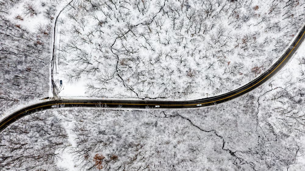 Snowy Winter Road by Jimmy Yang — canvas wall art